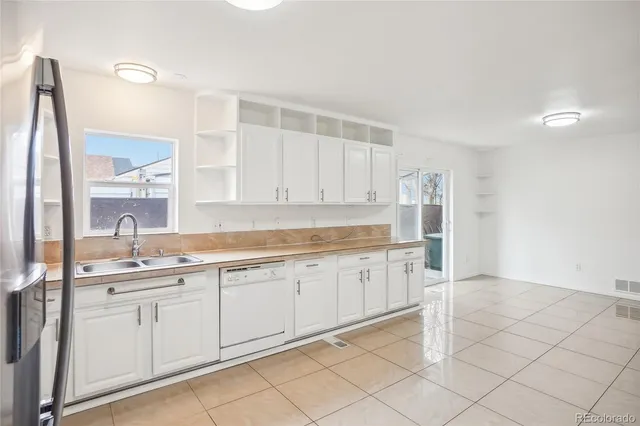 a kitchen with a sink and cabinets