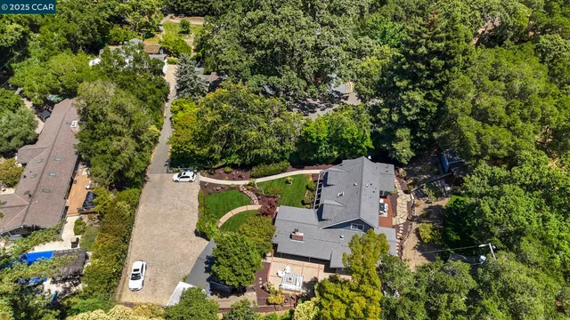 an aerial view of a house with outdoor space and street view