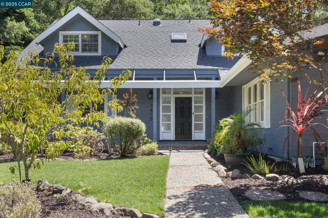 a front view of a house with garden