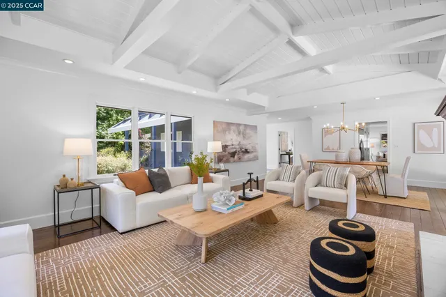 a living room with furniture and a rug
