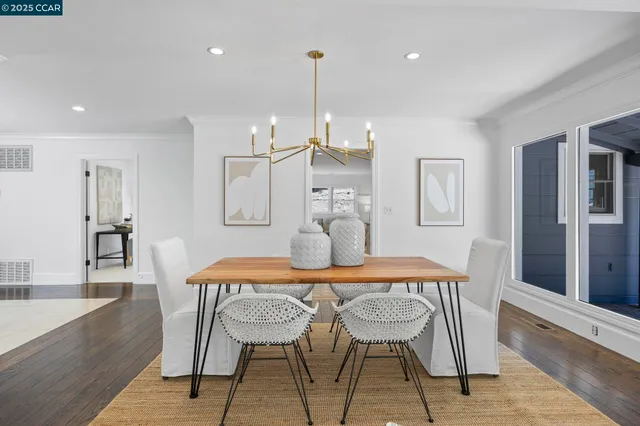 a dining room with furniture and window