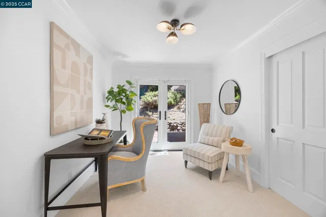 a living room with furniture a rug and a window