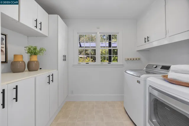 a view of storage and utility room with washer and dryer