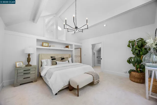 a bedroom with bed and wooden floor