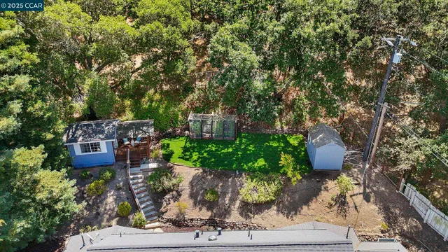an aerial view of a house with a garden