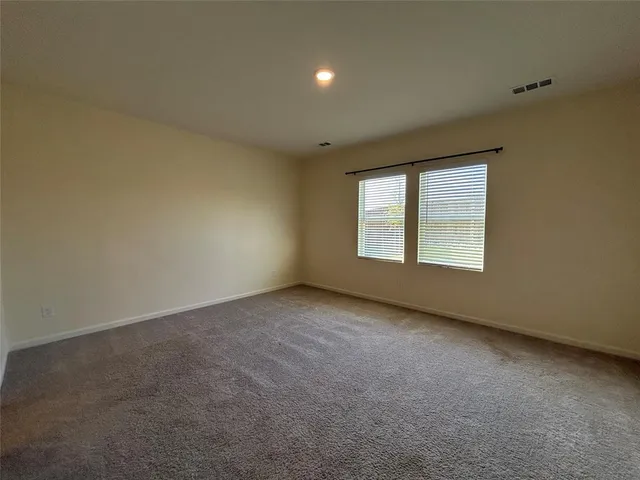 a view of kitchen with wooden floor and electronic appliances