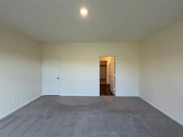 a large kitchen with stainless steel appliances granite countertop a stove a sink and a microwave