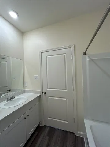 a bathroom with a sink and mirror