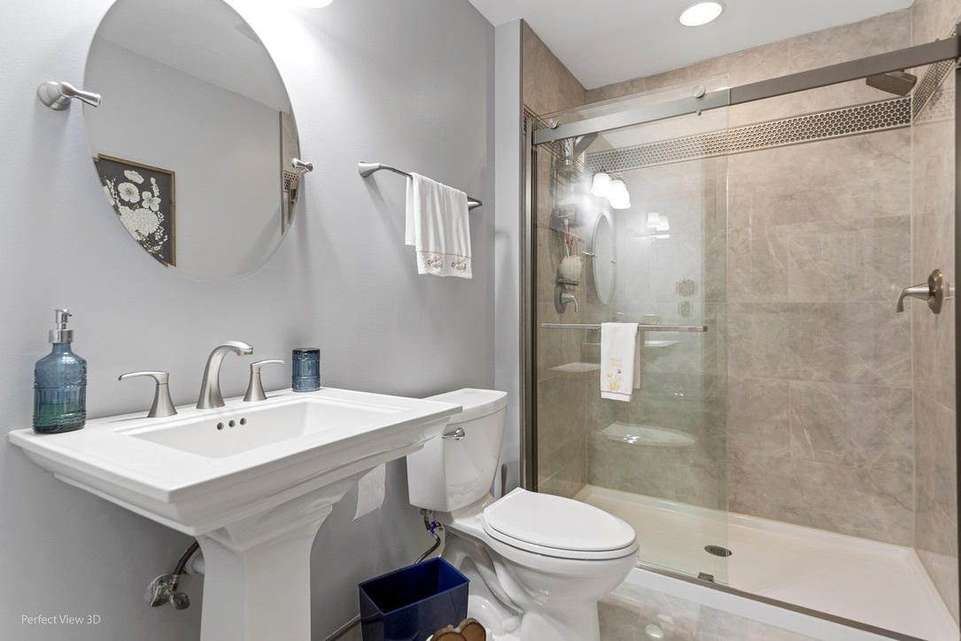 13836 West Joliet Road Manhattan, IL 60442 - Photo 11 of 25 a bathroom with a sink toilet and shower