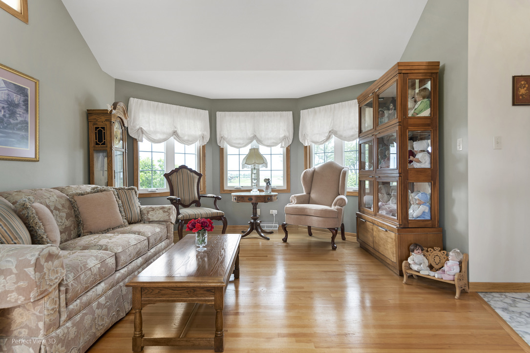 13836 West Joliet Road Manhattan, IL 60442 - Photo 12 of 25 a living room with furniture and a large window