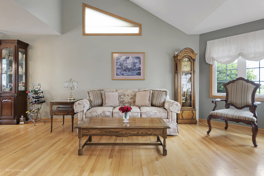 13836 West Joliet Road Manhattan, IL 60442 - Photo 13 of 25 a living room with furniture and a wooden floor