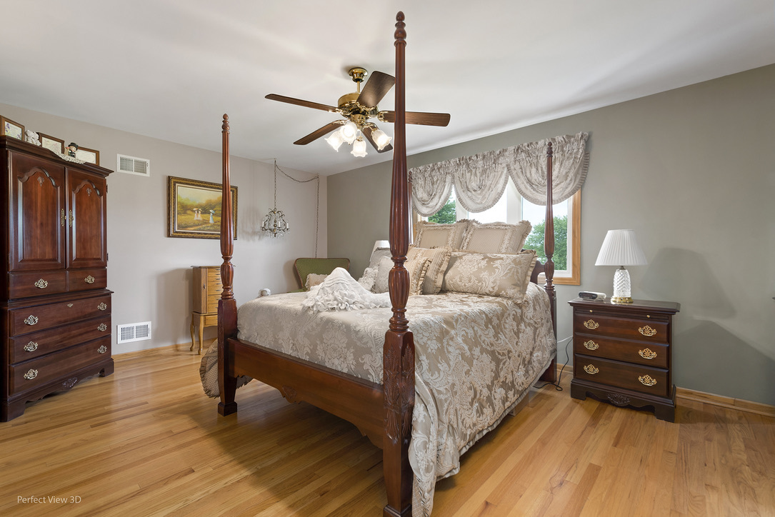 13836 West Joliet Road Manhattan, IL 60442 - Photo 17 of 25 a spacious bedroom with a bed dresser and a window