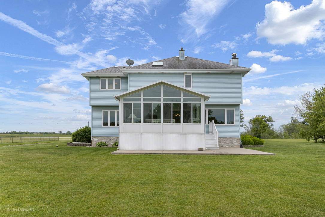 13836 West Joliet Road Manhattan, IL 60442 - Photo 24 of 25 a front view of a house with a yard