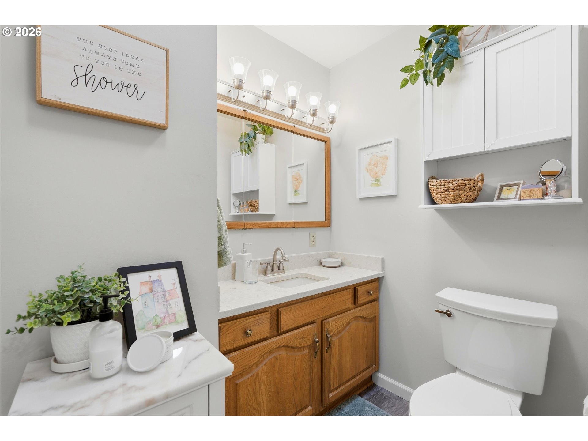 1841 Umpqua Road Woodburn, OR 97071 - Photo 30 of 41 a bathroom with a sink a mirror and a toilet