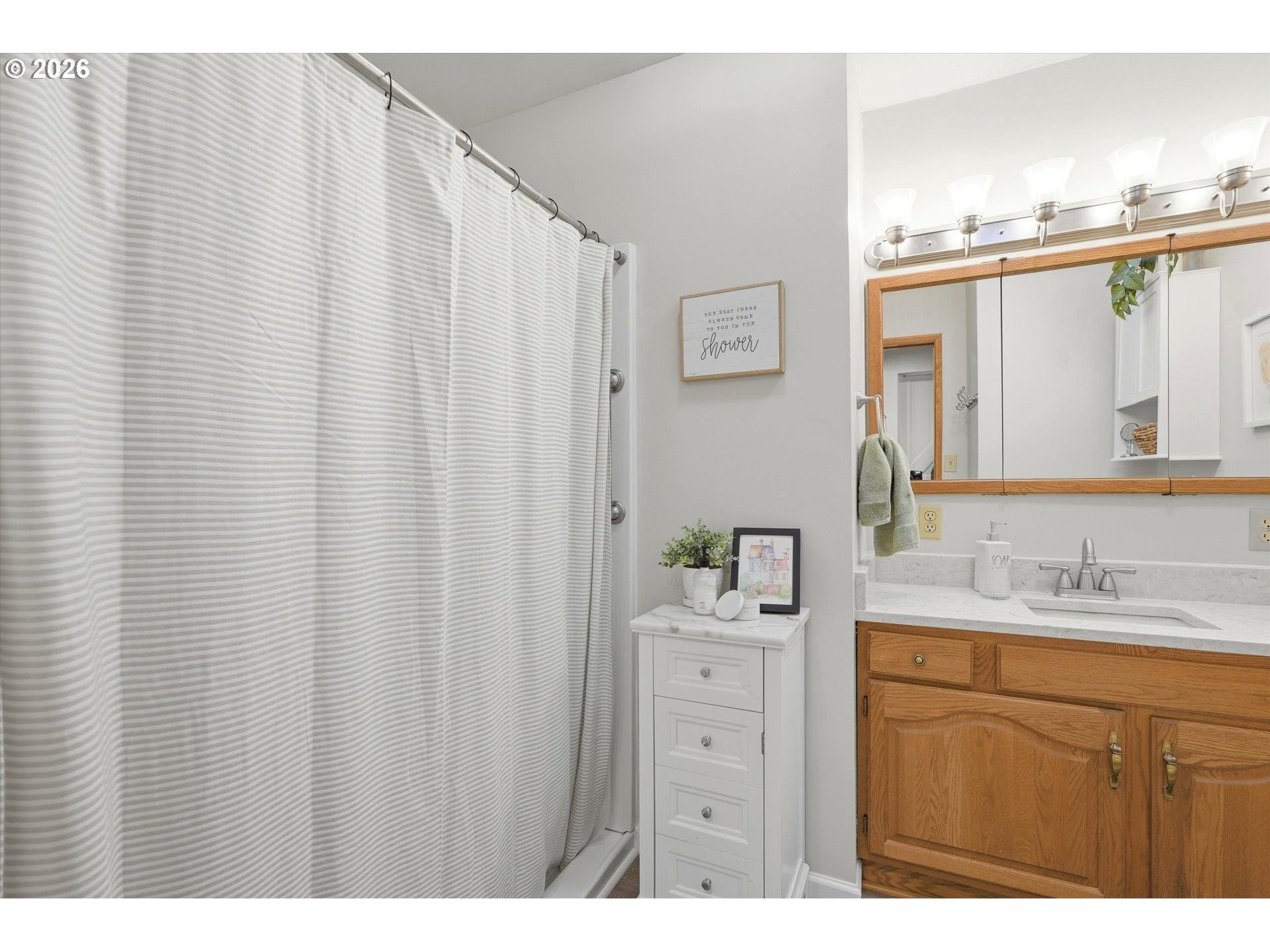 1841 Umpqua Road Woodburn, OR 97071 - Photo 31 of 41 a bathroom with a double vanity sink and a mirror