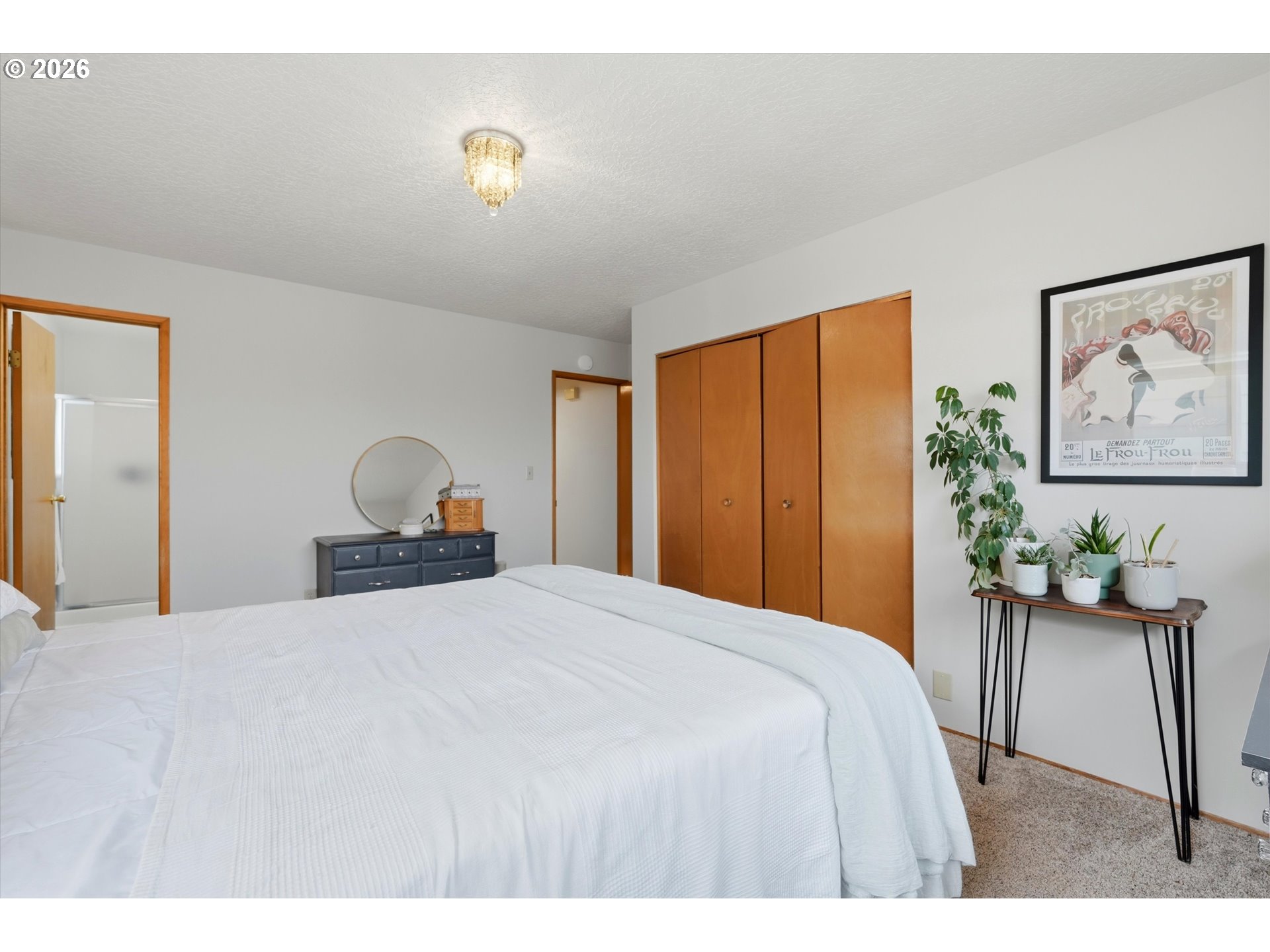 1841 Umpqua Road Woodburn, OR 97071 - Photo 35 of 41 a bedroom with a bed and a painting on the wall
