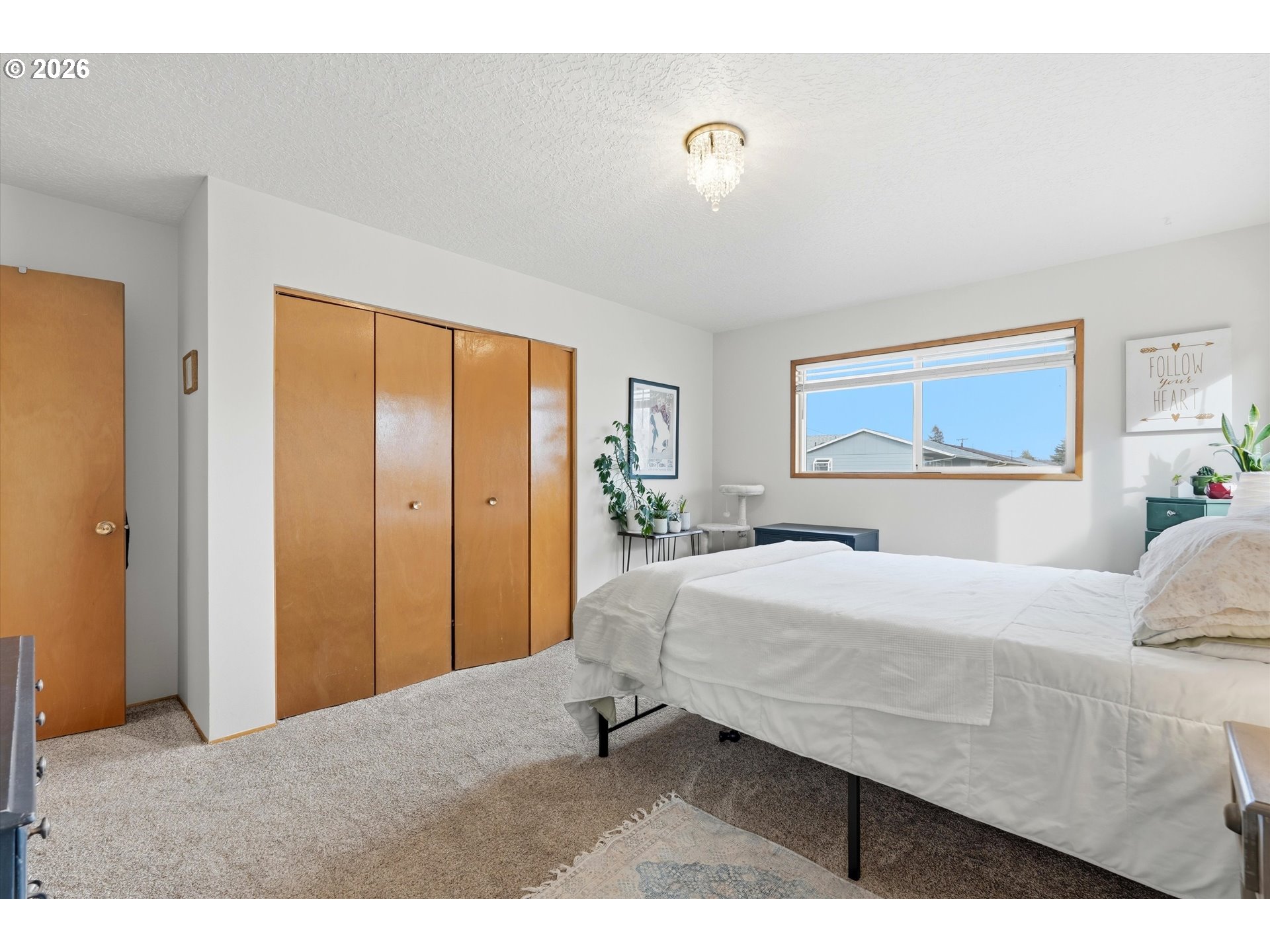 1841 Umpqua Road Woodburn, OR 97071 - Photo 36 of 41 a bedroom with a bed and a dresser