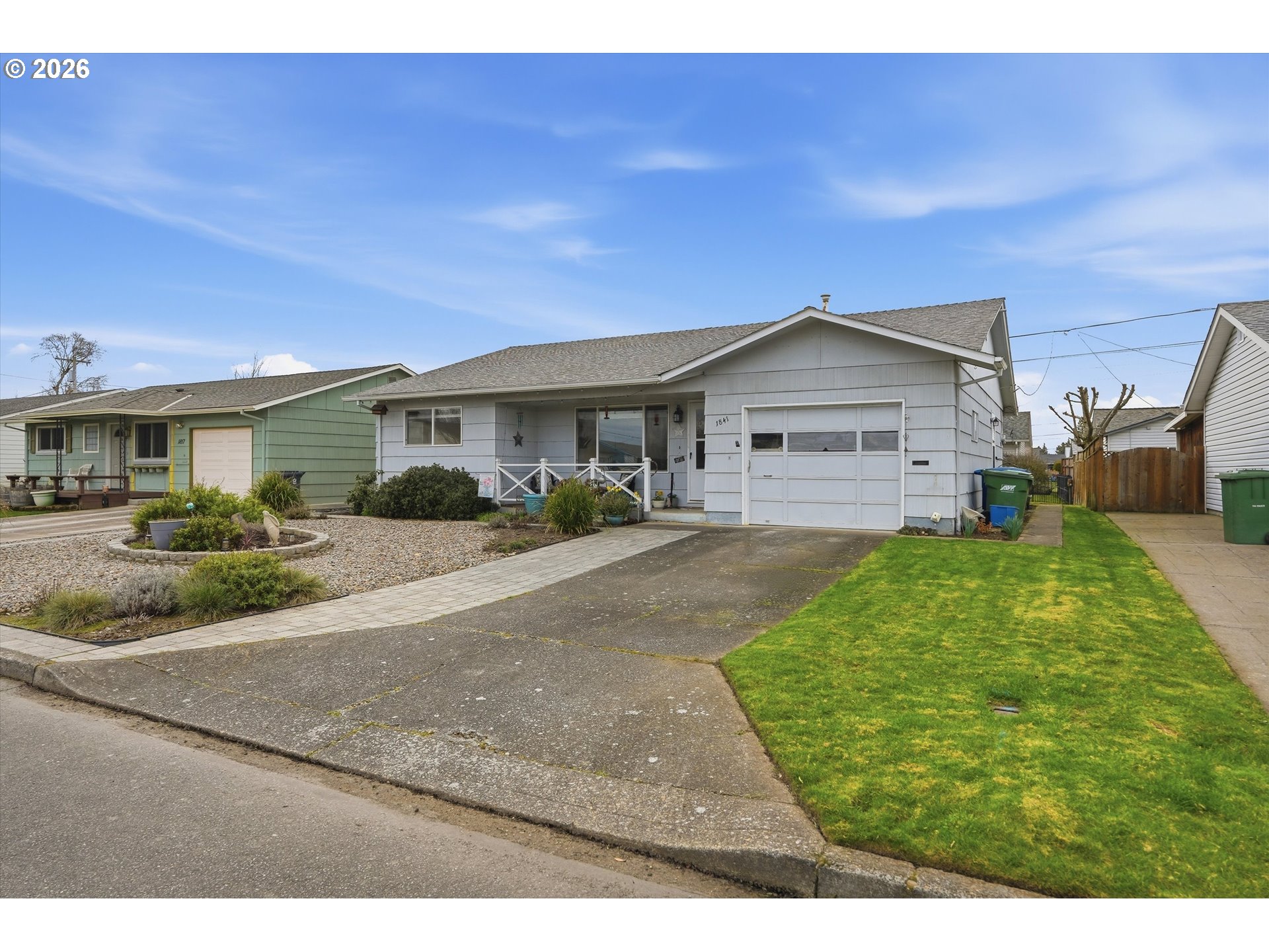 1841 Umpqua Road Woodburn, OR 97071 - Photo 4 of 41 a front view of a house with a yard and garage