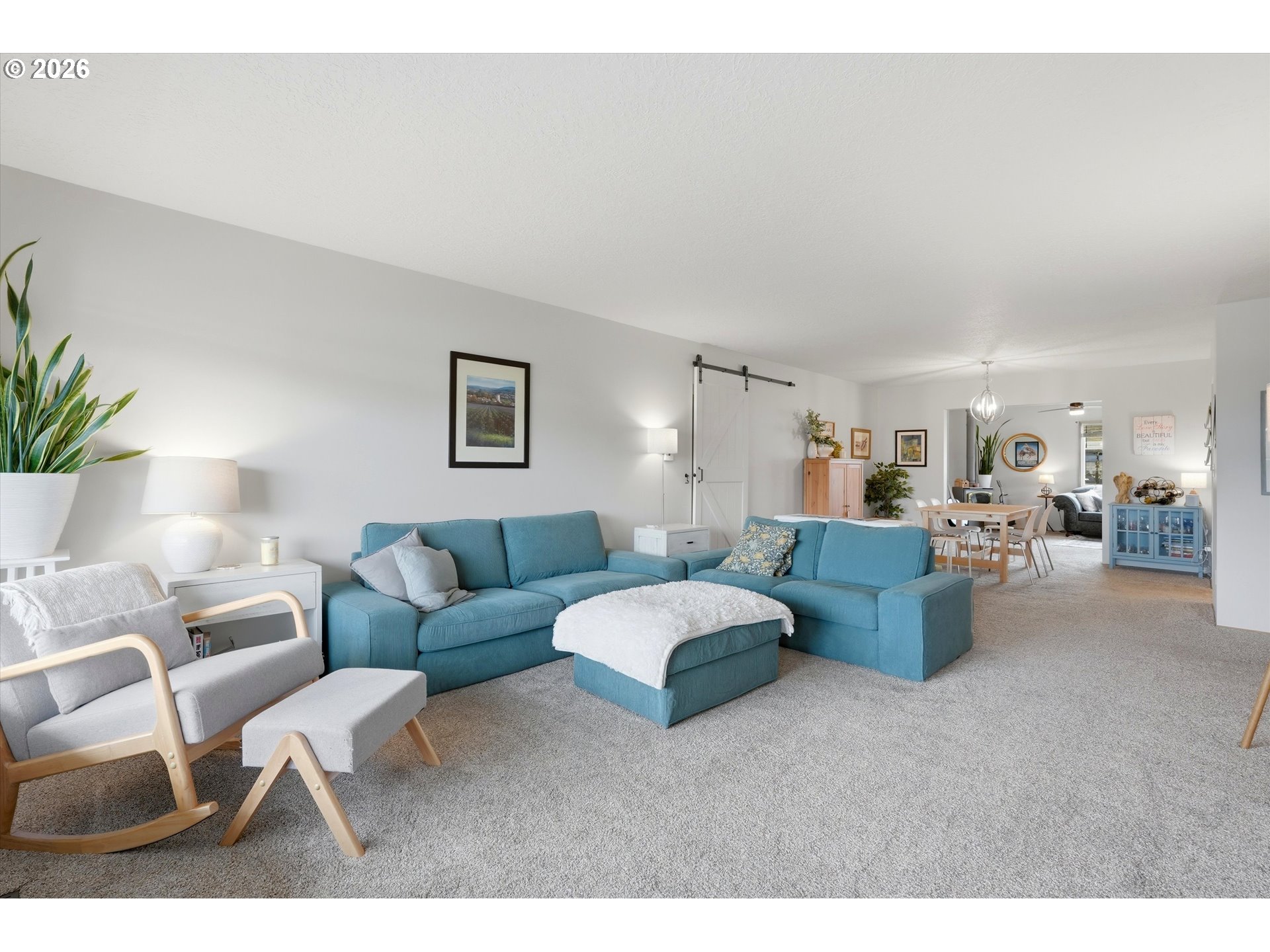 1841 Umpqua Road Woodburn, OR 97071 - Photo 7 of 41 a living room with furniture and a potted plant