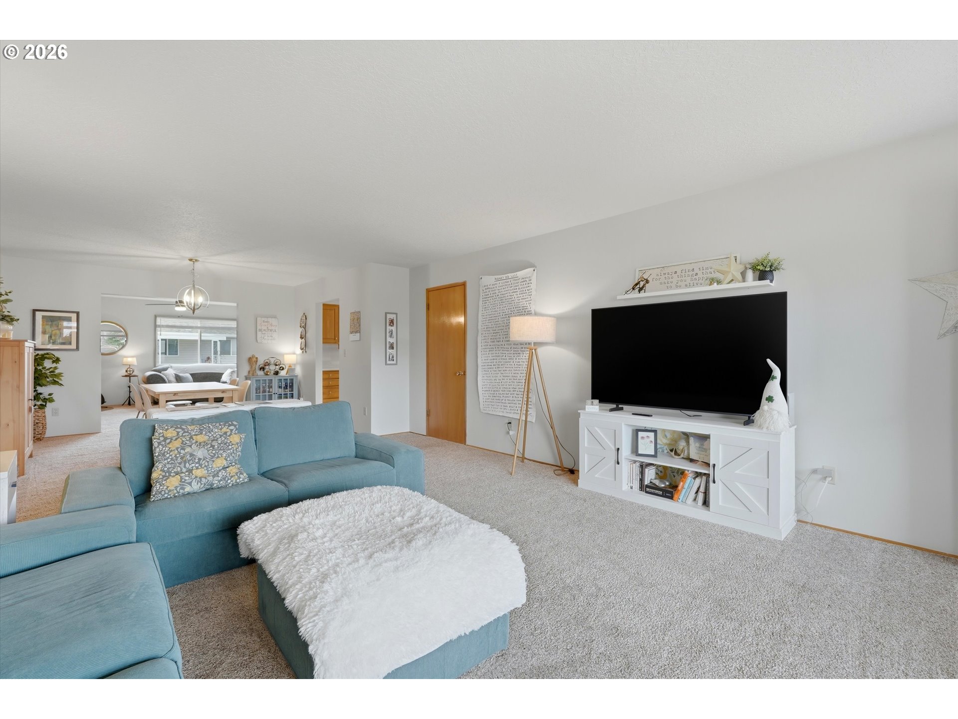 1841 Umpqua Road Woodburn, OR 97071 - Photo 8 of 41 a living room with furniture and a flat screen tv