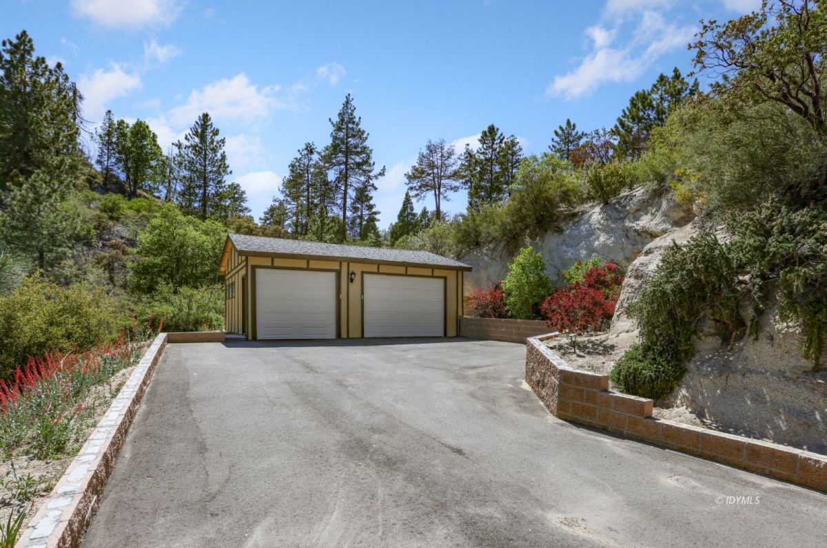 53460 West Ridge Road Idyllwild, CA 92549 - Photo 4 of 65 a front view of a house with a yard and garage