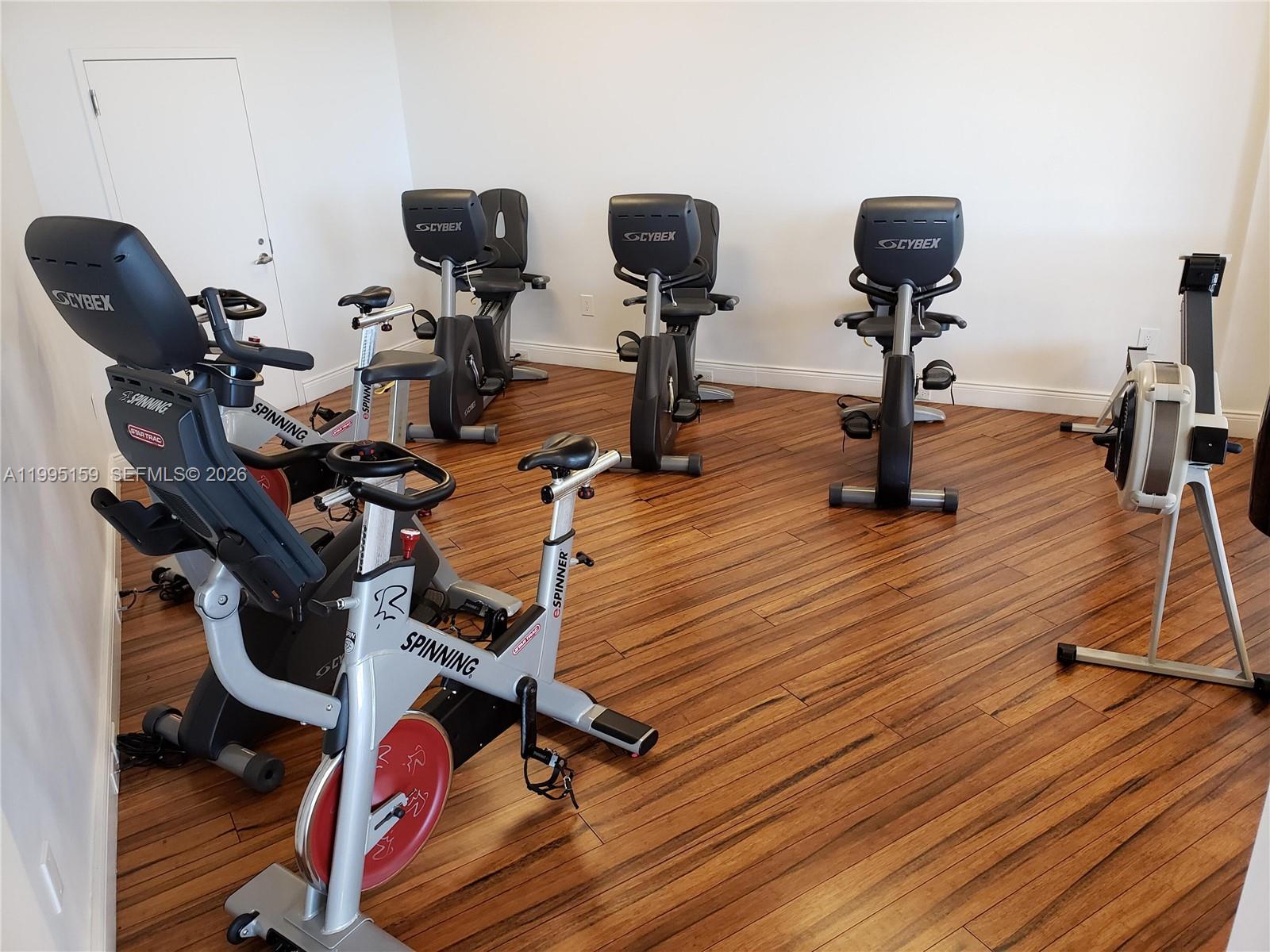 808 Brickell Key Drive, Unit 2002 Miami, FL 33131 - Photo 36 of 42 a view of a room with gym equipment
