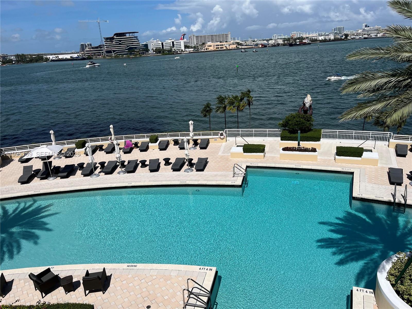 808 Brickell Key Drive, Unit 2002 Miami, FL 33131 - Photo 39 of 42 a view of a lake with couches