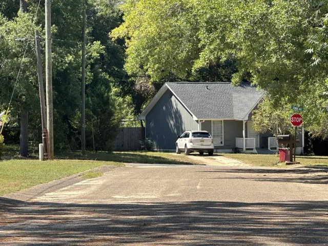 a view of street with houses on its side