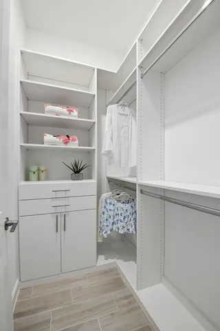 a living room with lots of furniture and kitchen view