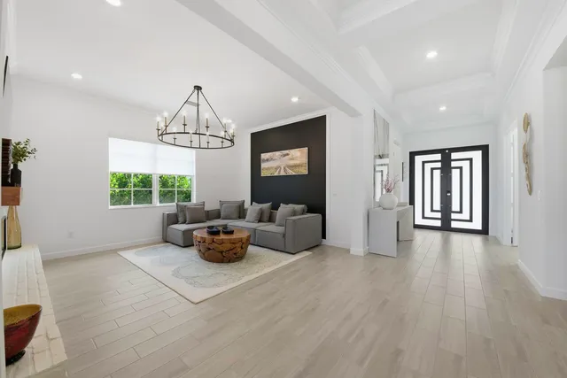 a large kitchen with a table and chairs