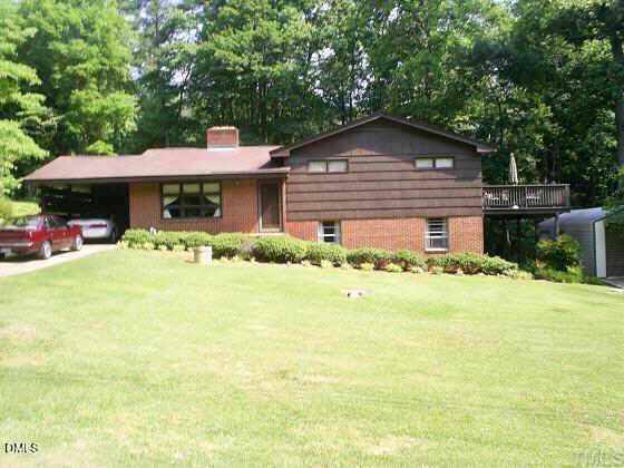 a front view of house with yard and seating area