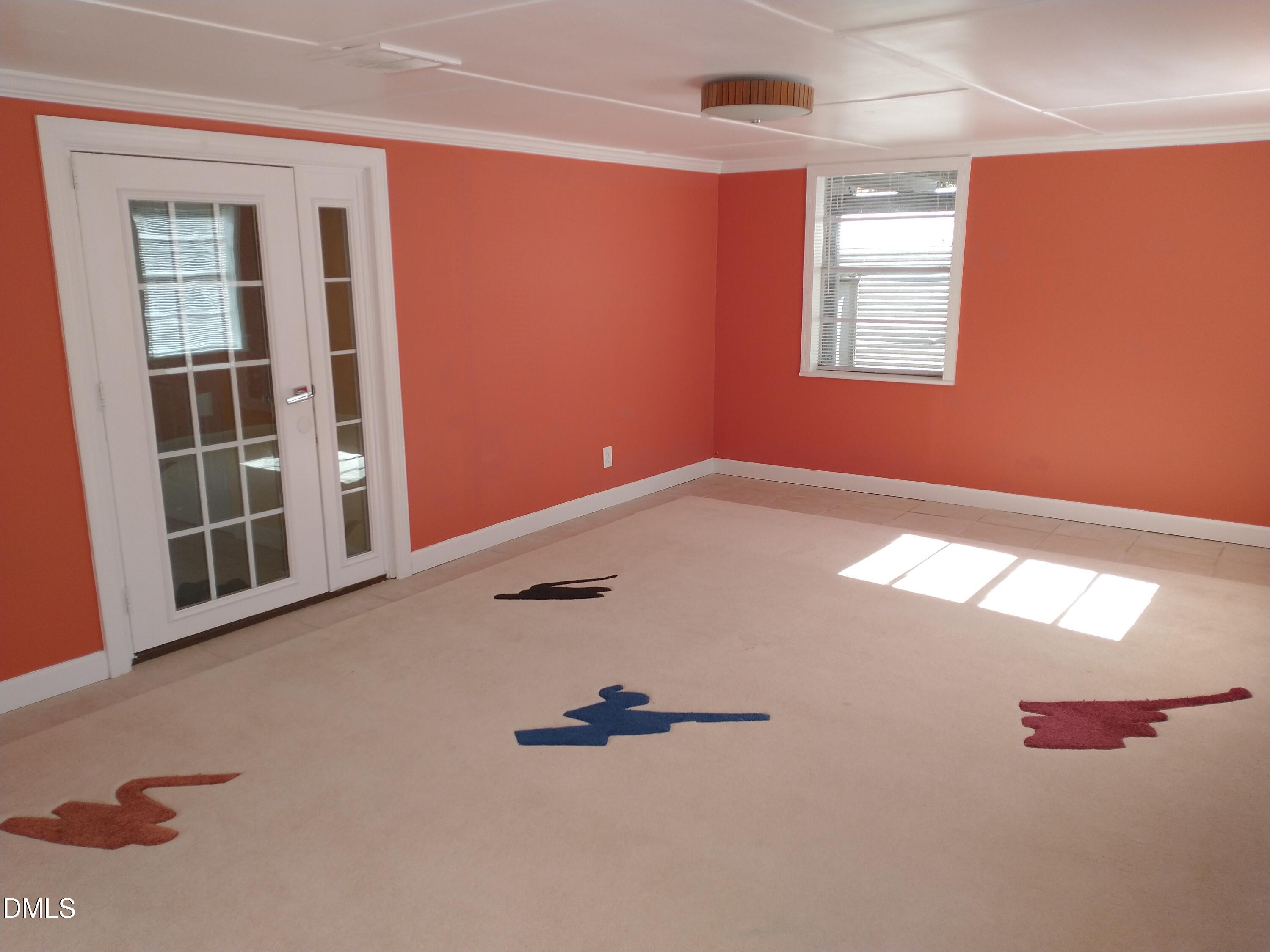 1302 Lorimer Road Raleigh, NC 27606 - Photo 19 of 23 an empty room with windows