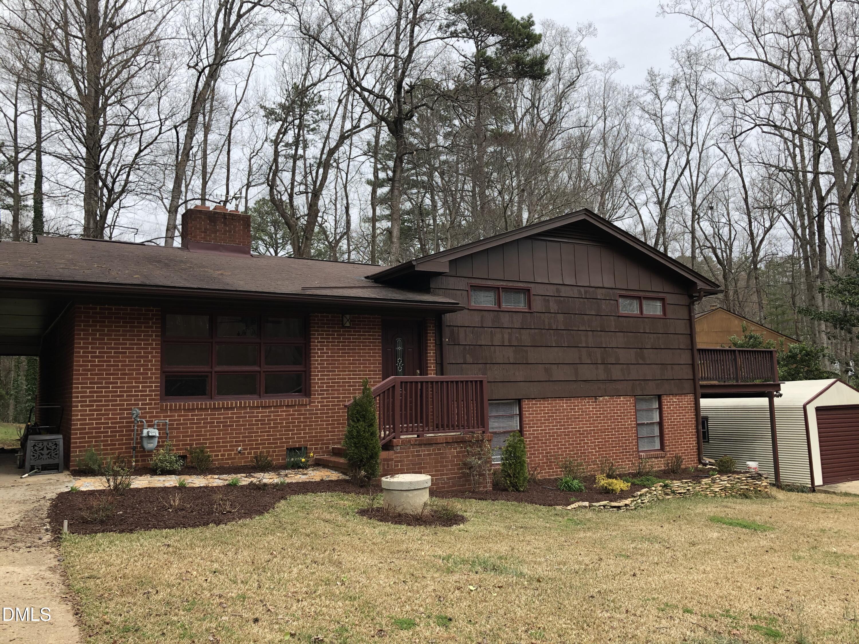 1302 Lorimer Road Raleigh, NC 27606 - Photo 2 of 23 a front view of a house with a yard