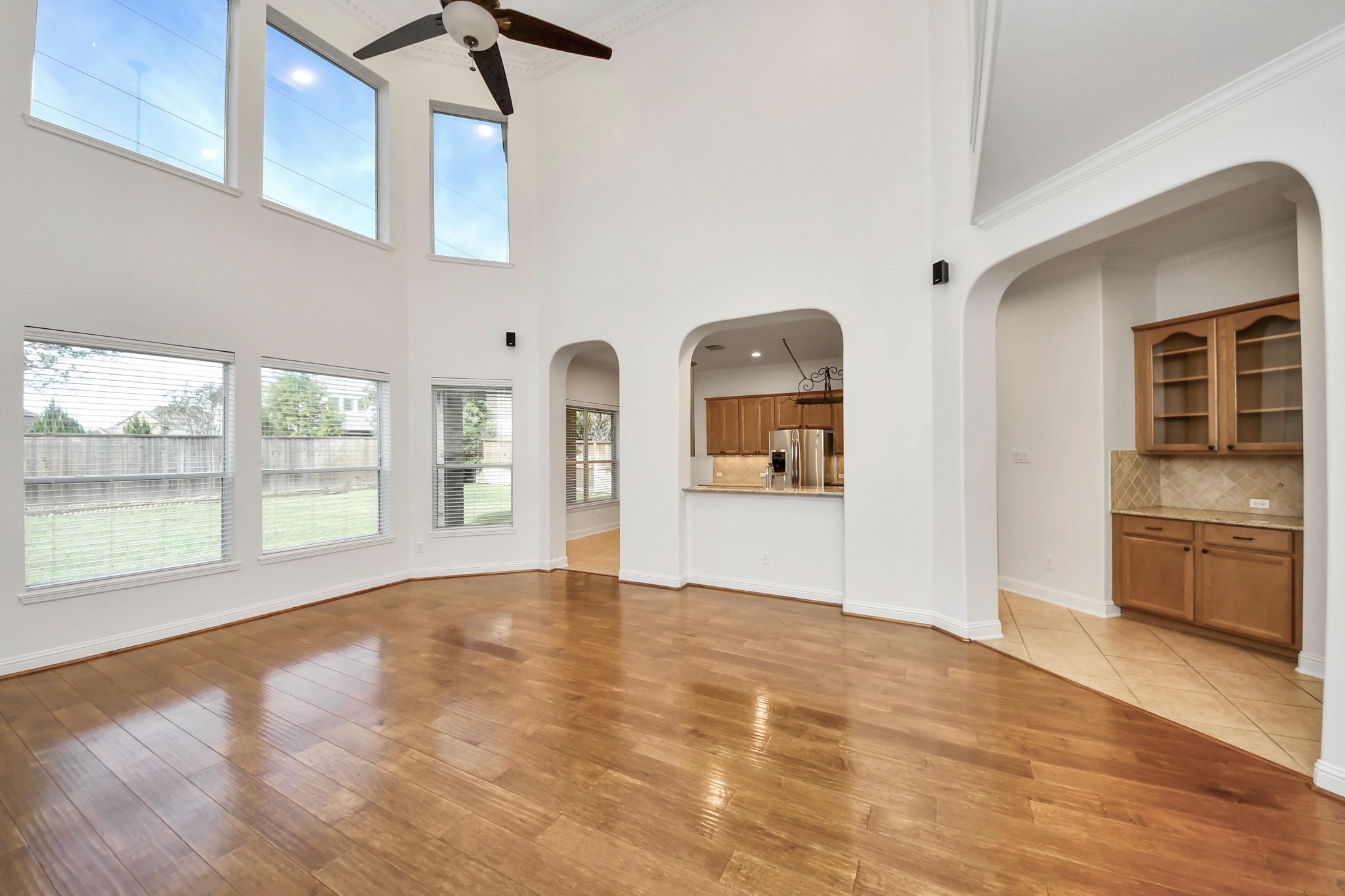20519 Rosespring Lane Spring, TX 77379 - Photo 12 of 49 a view of an empty room with a window and wooden floor