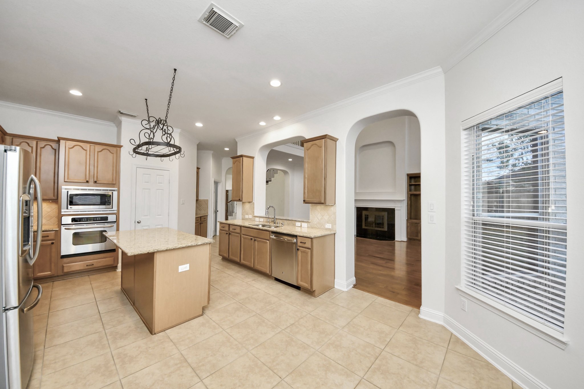 20519 Rosespring Lane Spring, TX 77379 - Photo 14 of 49 a large kitchen with a large counter top stainless steel appliances and cabinets