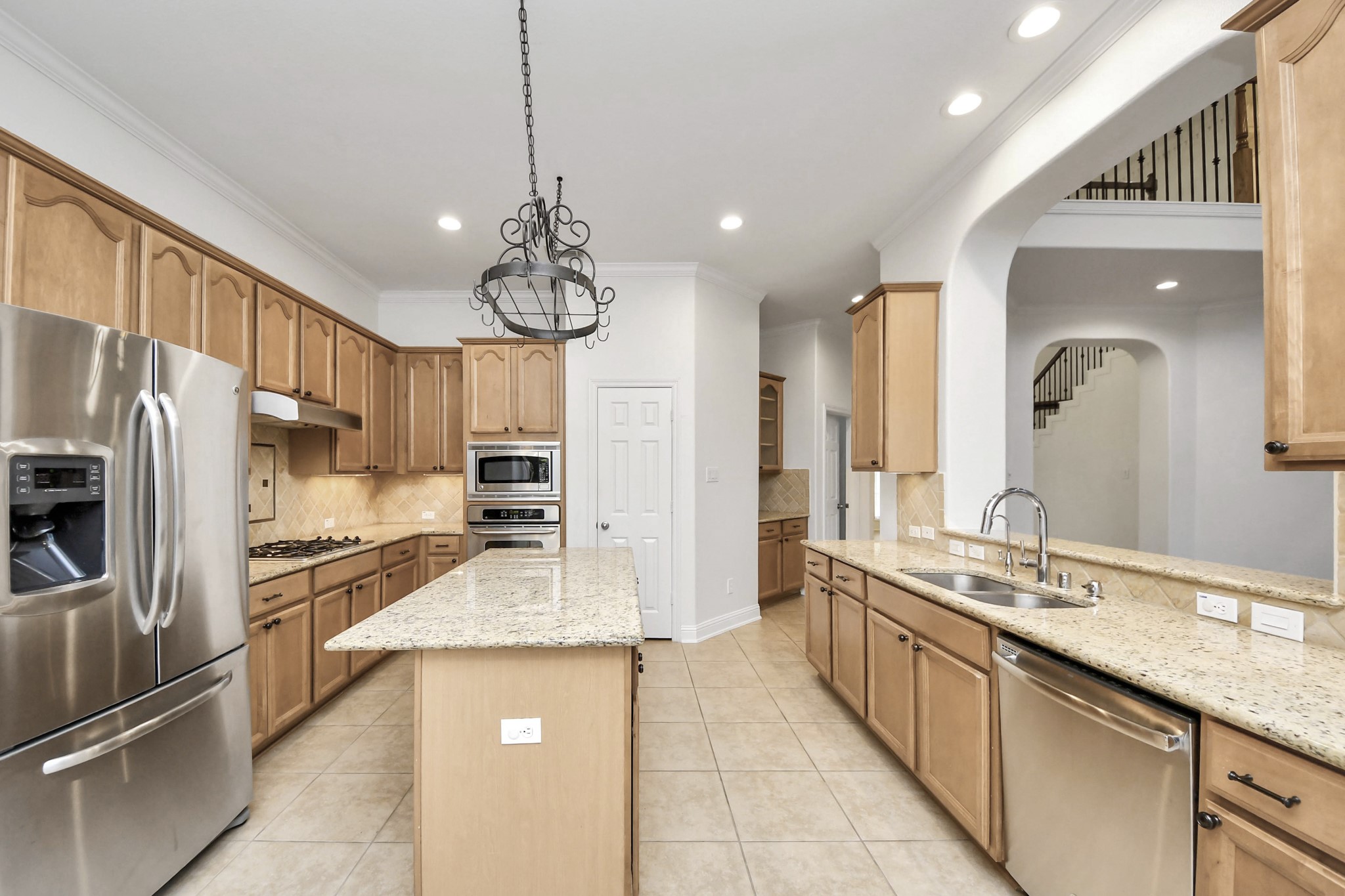 20519 Rosespring Lane Spring, TX 77379 - Photo 15 of 49 a large kitchen with granite countertop a large counter top appliances and cabinets