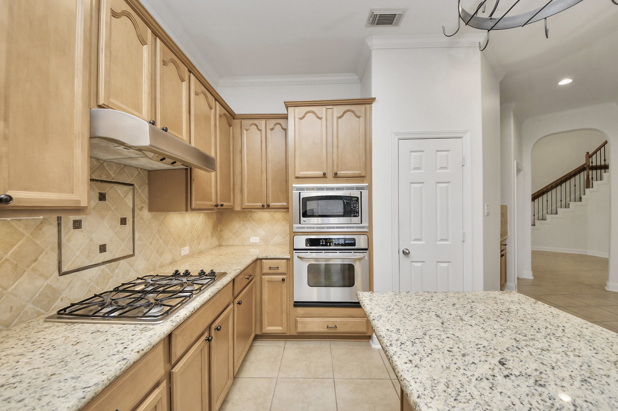 20519 Rosespring Lane Spring, TX 77379 - Photo 16 of 49 a kitchen with stainless steel appliances granite countertop a stove and a refrigerator