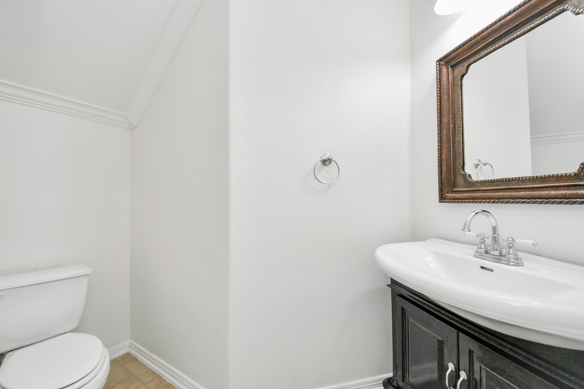 20519 Rosespring Lane Spring, TX 77379 - Photo 22 of 49 a bathroom with a toilet a sink and mirror