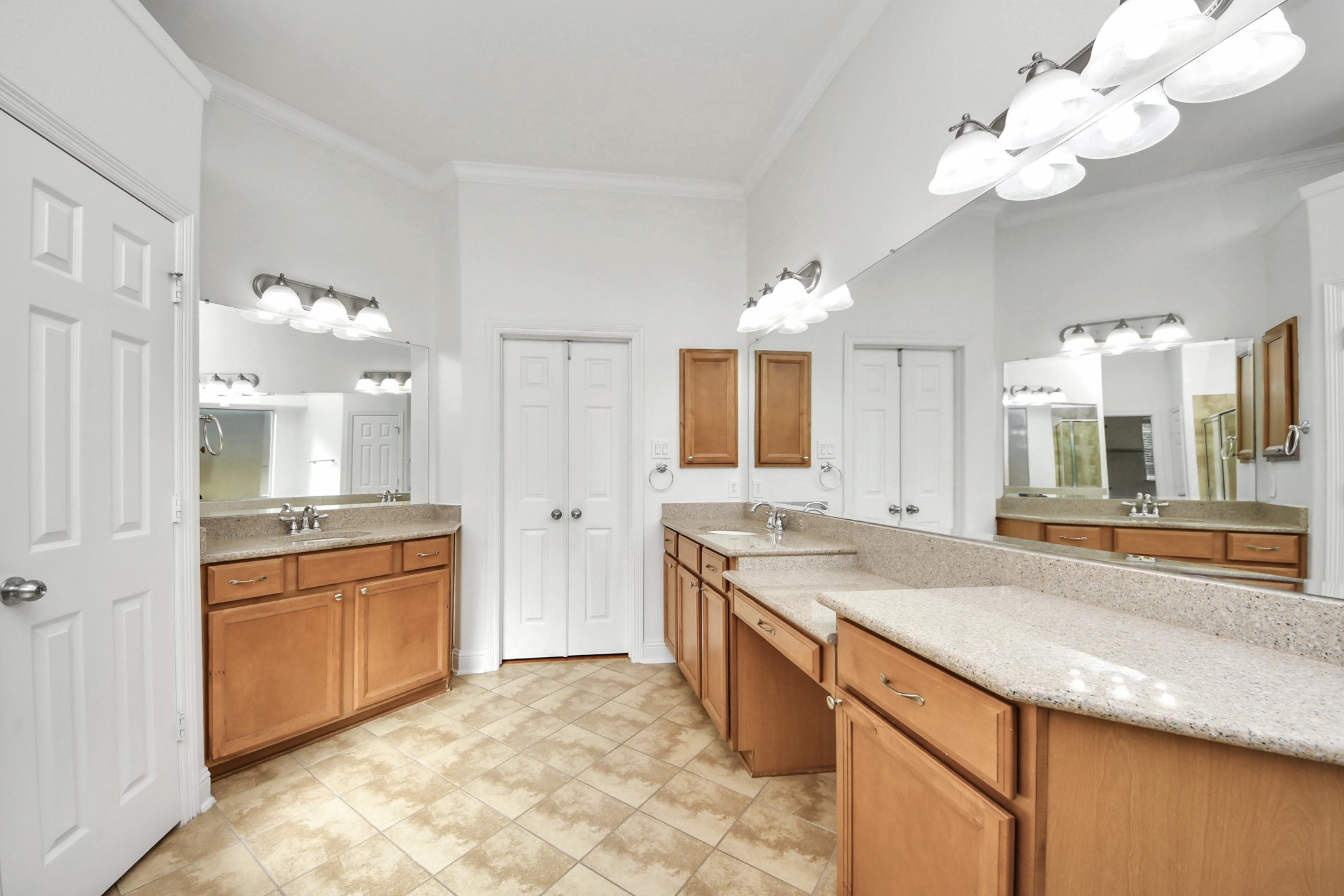 20519 Rosespring Lane Spring, TX 77379 - Photo 26 of 49 a large kitchen with kitchen island granite countertop a sink a stove and a large mirror