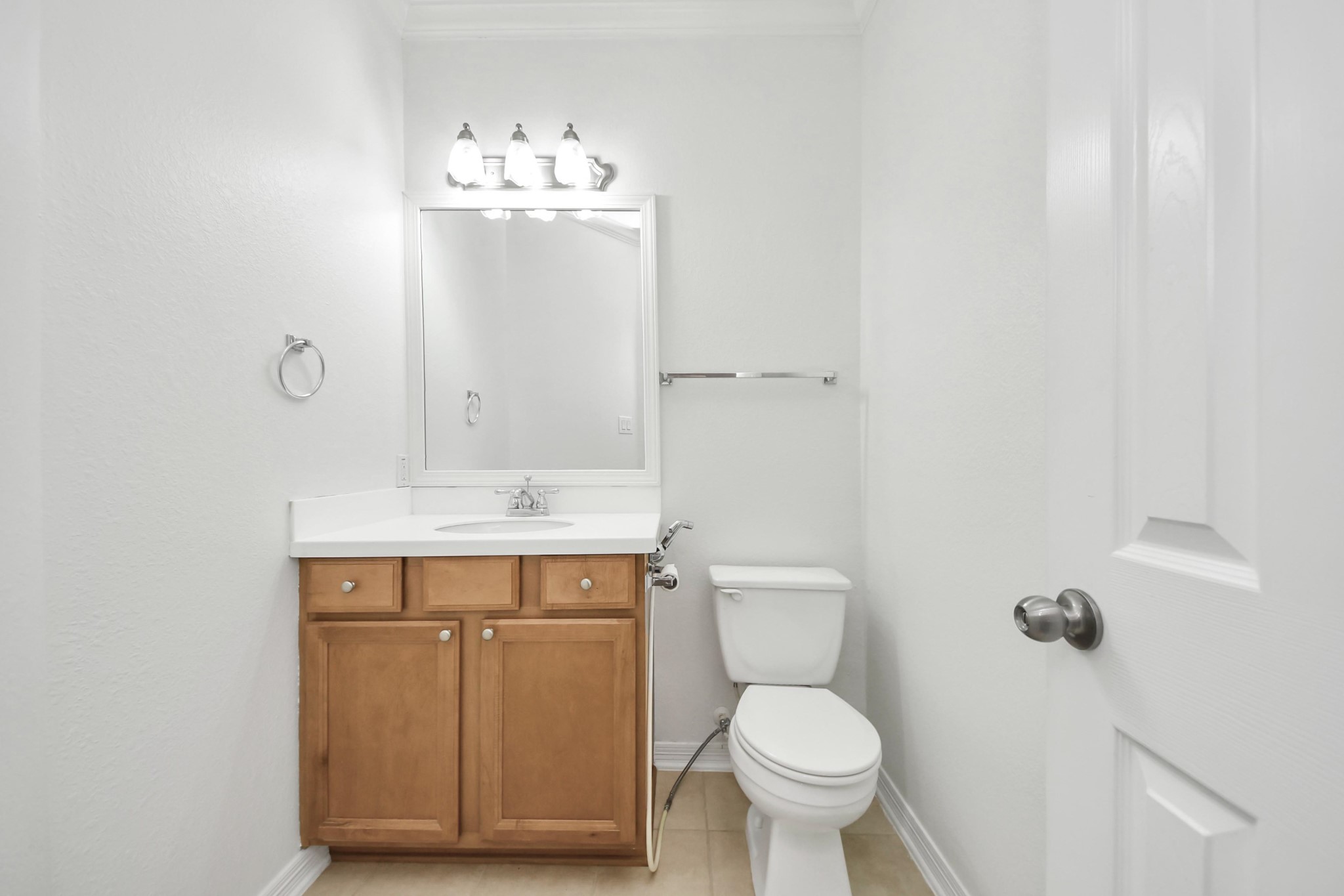 20519 Rosespring Lane Spring, TX 77379 - Photo 33 of 49 a bathroom with a toilet sink and mirror