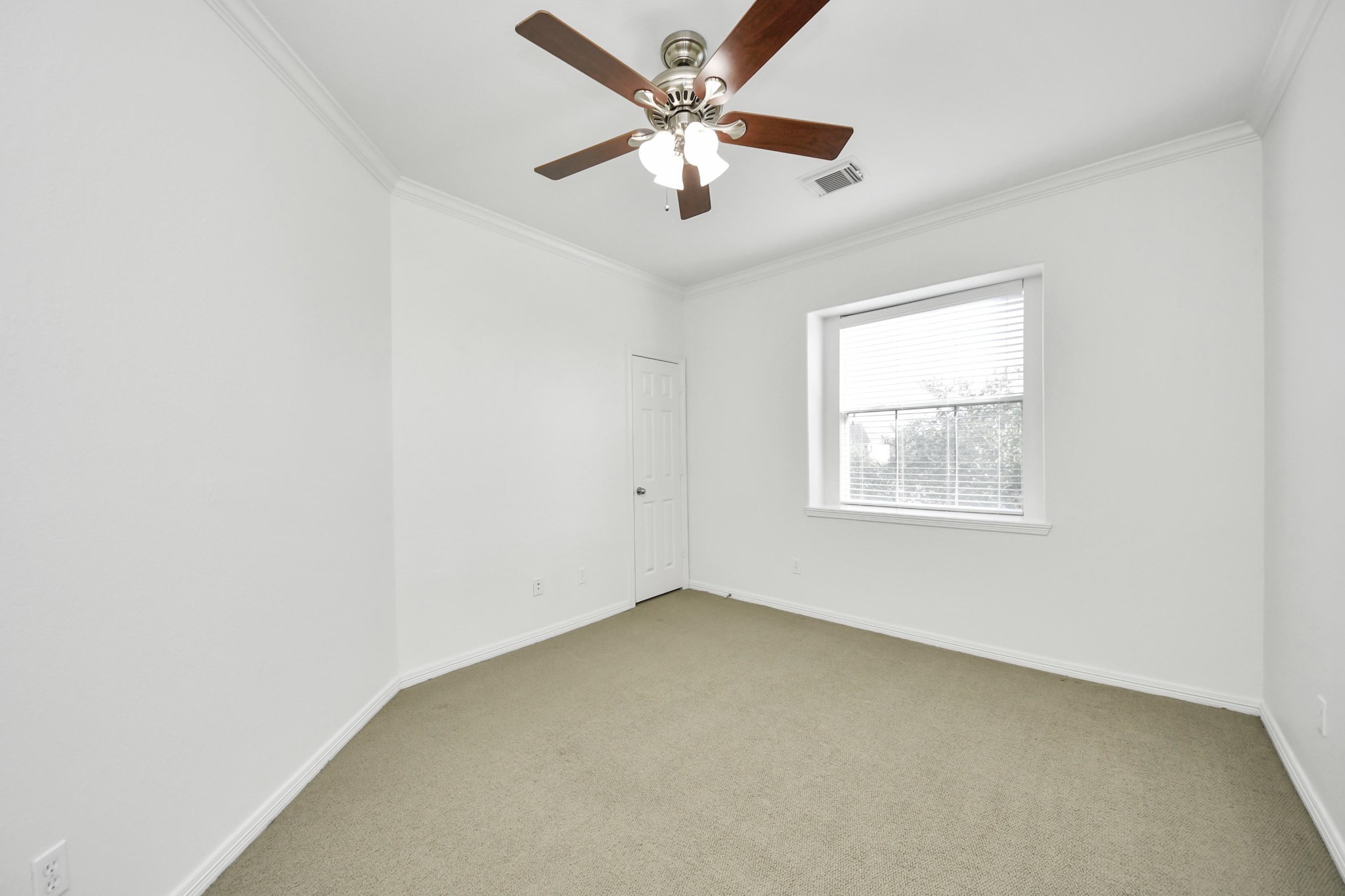 20519 Rosespring Lane Spring, TX 77379 - Photo 40 of 49 an empty room with a window and a ceiling fan
