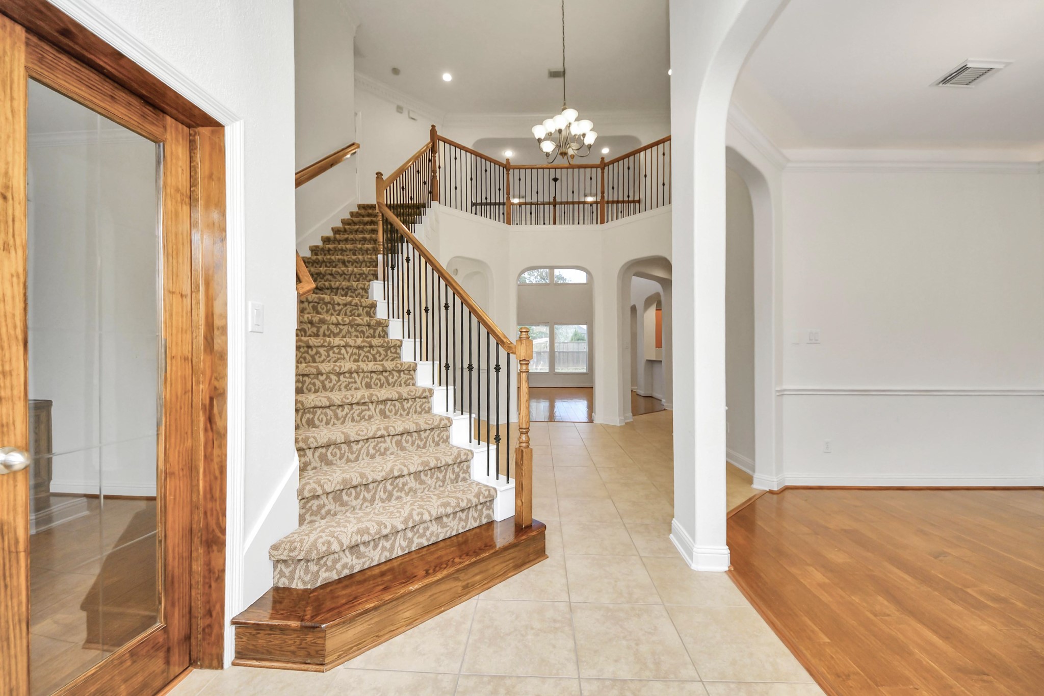 20519 Rosespring Lane Spring, TX 77379 - Photo 4 of 49 a view of a hallway with a chandelier and dining room view