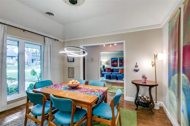 a dining room with a table and chairs