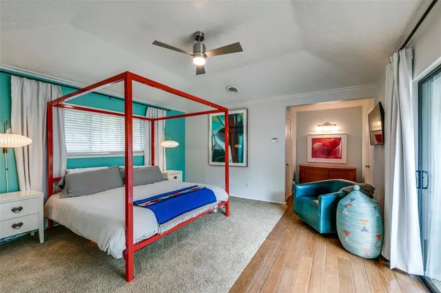 a bedroom with a bed and a mirror