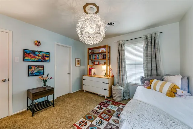 a bedroom with furniture and a window