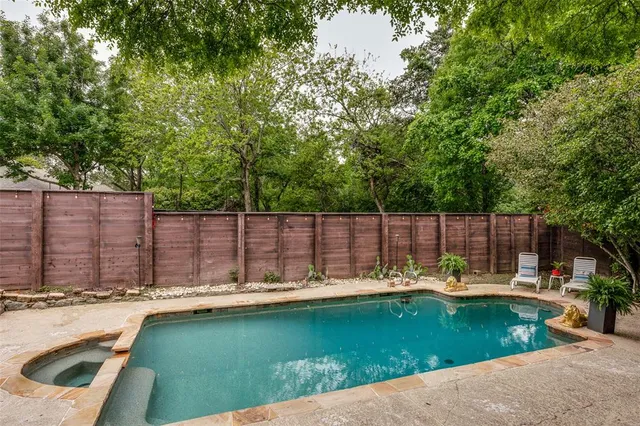 a view of a swimming pool with a patio