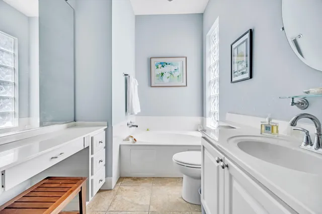 a bathroom with a sink a toilet and bathtub