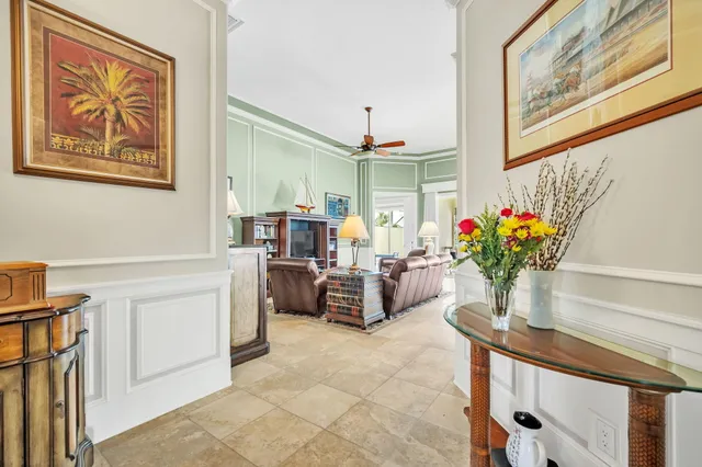a view of living room filled with furniture and flower pot