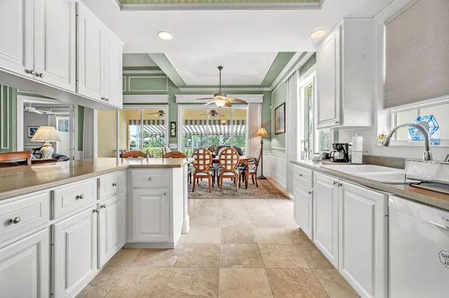 a large white kitchen with lots of counter space