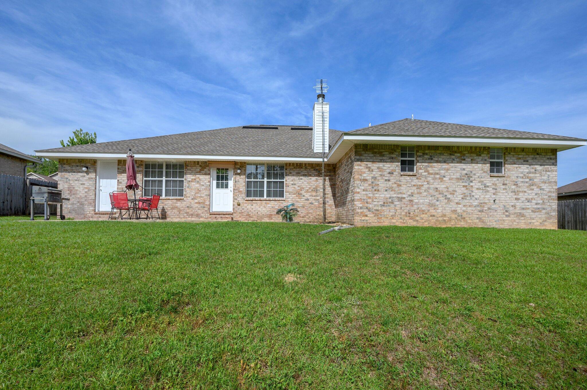 111 Strike Eagle Drive Crestview, FL 32536 - Photo 2 of 2 a front view of a house with a yard
